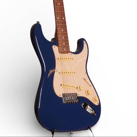 Blue electric guitar with a wooden neck on a white background